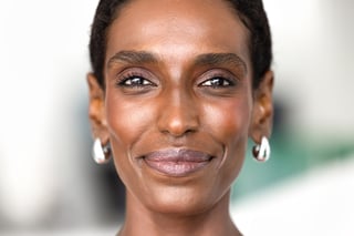 Jamaican woman with bold dramatic lashes