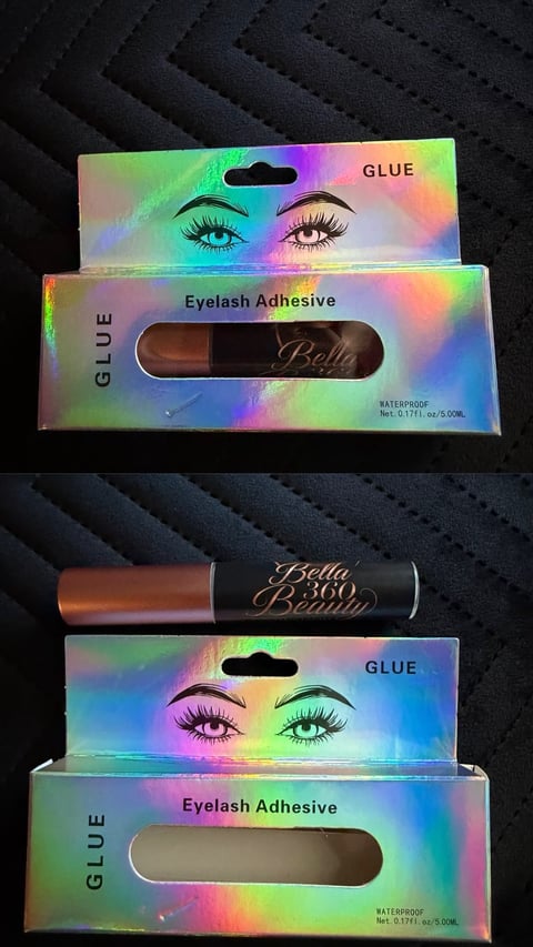 Two boxes of Bella eyelash adhesive glue with holographic rainbow packaging and brush applicators displayed on dark background